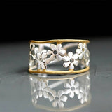 Irregular floral ring with hollow design